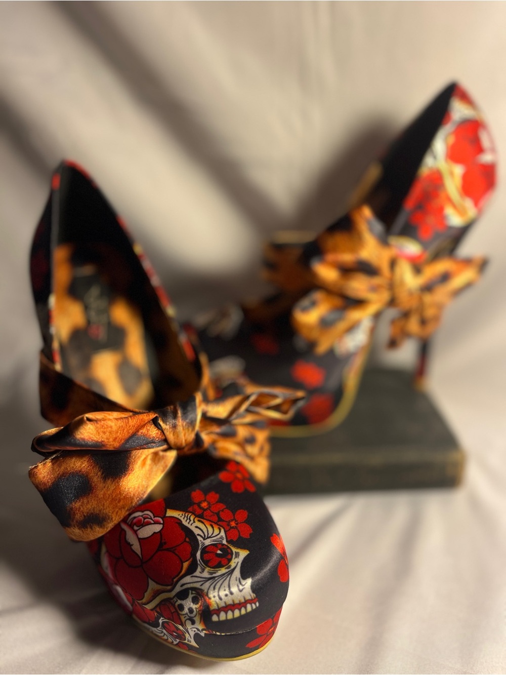 Women’s Iron Fist Siesta Skull Black Floral Skull Print Heels with Bow Accent